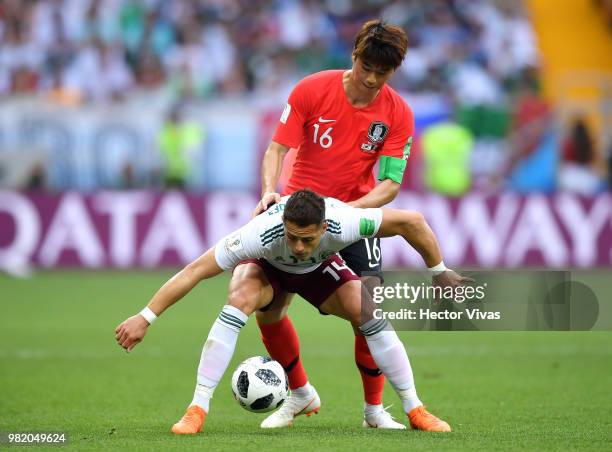 Javier Hernandez of Mexico is challenged by Ki Sung-Yueng of Korea Republic during the 2018 FIFA World Cup Russia group F match between Korea...