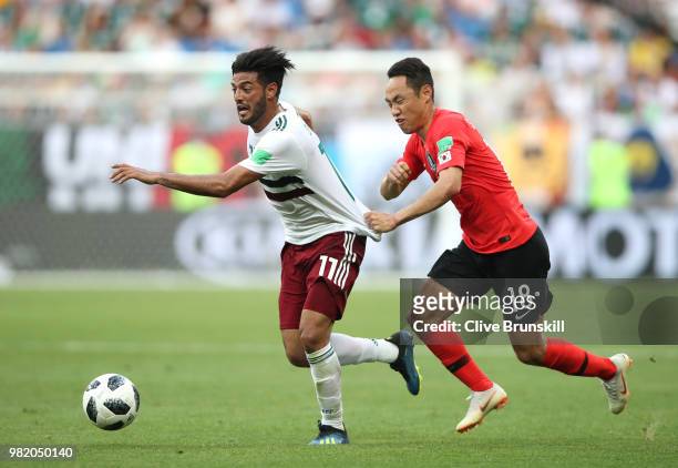 Carlos Vela of Mexico is challenged by Moon Seon-Min during the 2018 FIFA World Cup Russia group F match between Korea Republic and Mexico at Rostov...