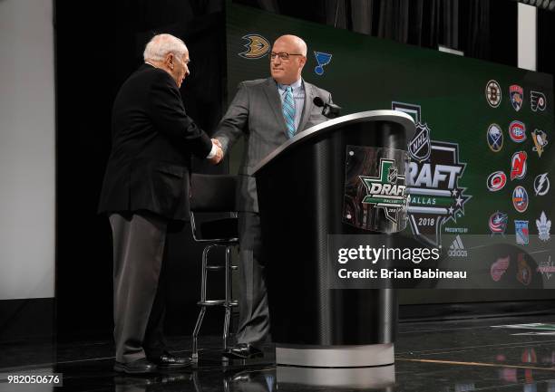Deputy Commissioner Bill Daly pays tribute to NHL Executive Jim Gregory during the 2018 NHL Draft at American Airlines Center on June 23, 2018 in...