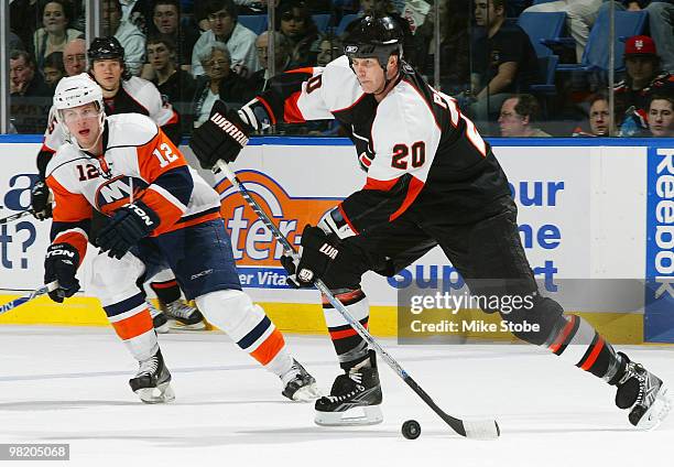 Chris Pronger of the Philadelphia Flyers is pursued by Josh Bailey of the New York Islanders on April 1, 2010 at Nassau Coliseum in Uniondale, New...