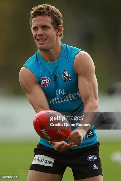 Luke Ball of the Magpies handballs during a Collingwood Magpies training session at Gosch's Paddock on April 2, 2010 in Melbourne, Australia.