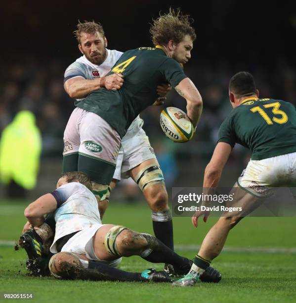 Snyman of South Africa is held by Joe Launchbury and Chris Robshaw during the third test match between South Africa and England at Newlands Stadium...