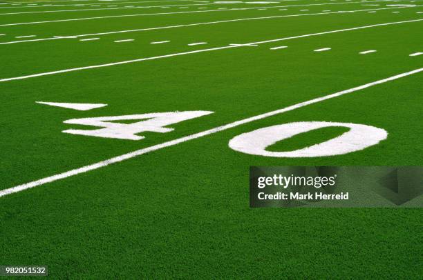 forty yard line on american football field - forty yard line stock pictures, royalty-free photos & images