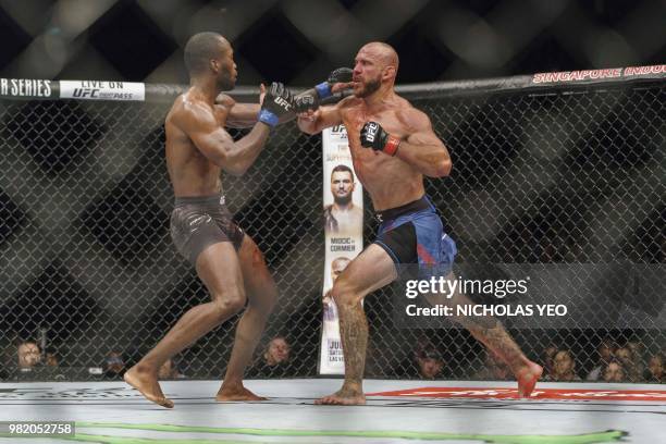 Mixed martial arts fighter Donald 'Cowboy' Cerrone of the US fights against Leon 'Rocky' Edwards of Britain during the UFC Fight night in Singapore...