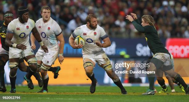 Chris Robshaw of Engand breaks away from Faf de Klerk during the third test match between South Africa and England at Newlands Stadium on June 23,...