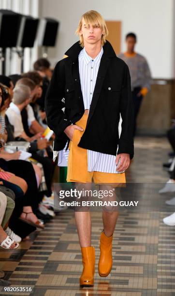 Model presents a creation by Wooyoungmi during the men's Spring/Summer 2019 collection fashion show on June 23, 2018 in Paris.