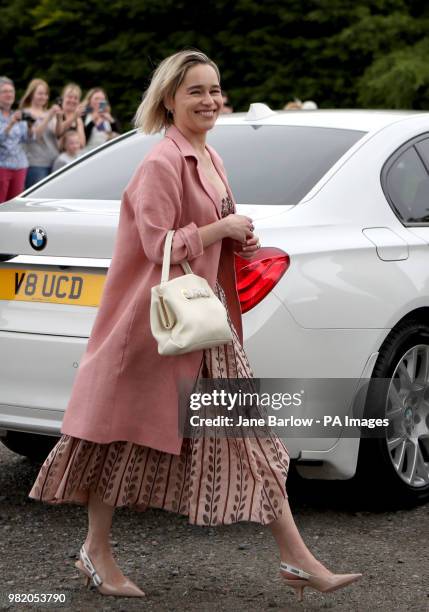 Actress Emilia Clarke arrives at Rayne Church, Kirkton of Rayne in Aberdeenshire, for the wedding ceremony of her Game Of Thrones co-stars Kit...