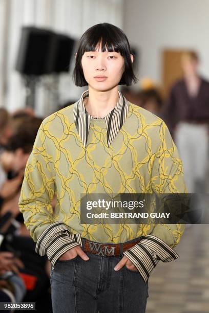 Model presents a creation by Wooyoungmi during the men's Spring/Summer 2019 collection fashion show on June 23, 2018 in Paris.