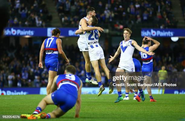 The Kangaroos celebrate at the final siren and winning the round 14 AFL match between the Western Bulldogs and the North Melbourne Kangaroos at...