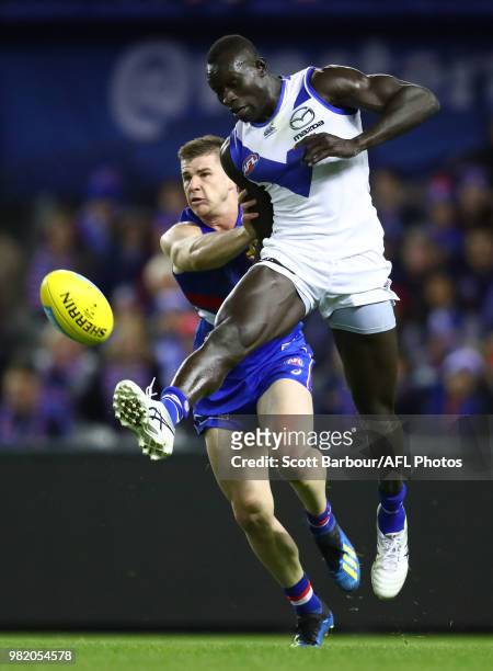 Majak Daw of the Kangaroos competes for the ball during the round 14 AFL match between the Western Bulldogs and the North Melbourne Kangaroos at...