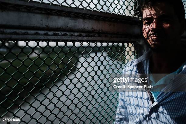 Honduran man, fleeing poverty and violence in his home country, waits along the border bridge after being denied into the Texas city of Brownsville...