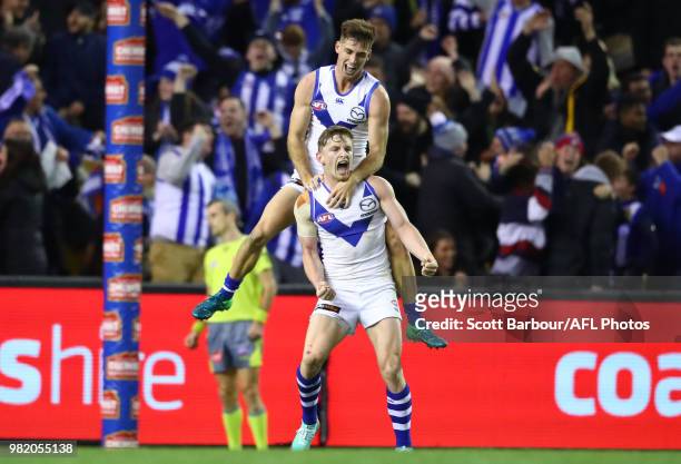 Jack Ziebell of the Kangaroos celebrates with Shaun Atley of the Kangaroos after kicking the match winning goal during the round 14 AFL match between...