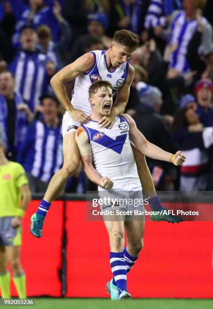 Jack Ziebell of the Kangaroos celebrates with Shaun Atley of the Kangaroos after kicking the match winning goal during the round 14 AFL match between...