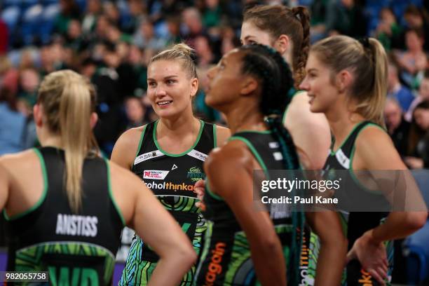 Courtney Bruce of the Fever looks on with team mates before taking to the court during the round eight Super Netball match between the Fever and the...