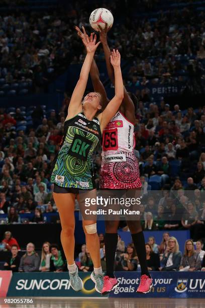 Courtney Bruce of the Fever and Shimona Nelson of the Thunderbirds contest for the ball during the round eight Super Netball match between the Fever...