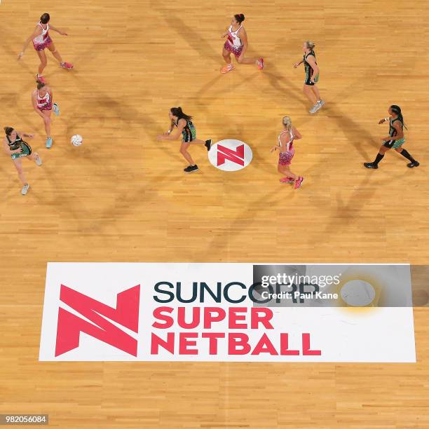 Verity Charles of the Fever passes the ball during the round eight Super Netball match between the Fever and the Thunderbirds at Perth Arena on June...