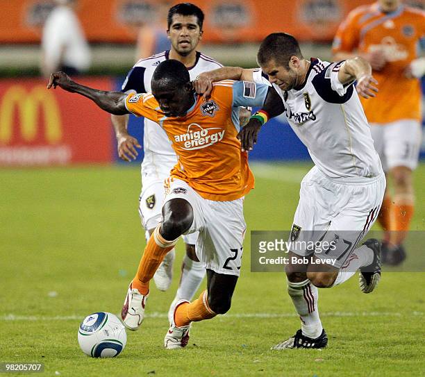 Houston Dynamo forward Dominic Oduro and Chris Wingert of Real Salt Lake battle for the ball on April 1, 2010 in Houston, Texas.