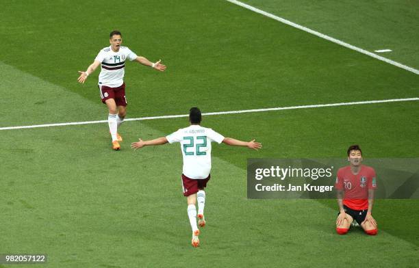 Javier Hernandez of Mexico celebrates after scoring his team's second goal, as Hyunsoo Jang of Korea Republic looks dejected during the 2018 FIFA...