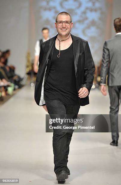 Designer Evan Biddell walks the runway wearing Bustle fall 2010 collection at the Allstream Centre on April 1, 2010 in Toronto, Canada.