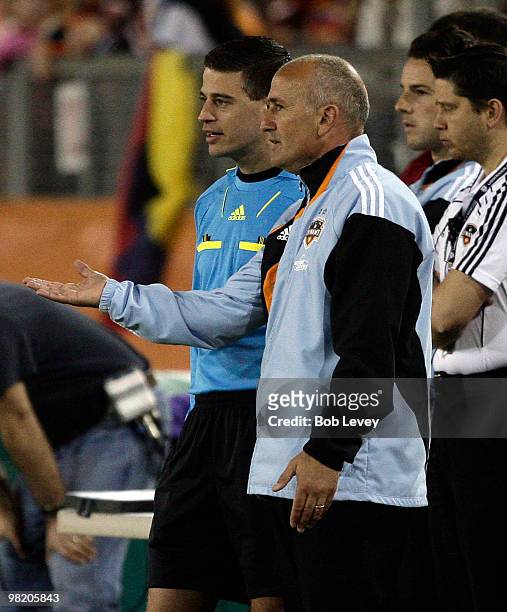 Head coach Dominic Kinnear of the Houston Dynamo complains to 4th Official Elias Bazakos in the first half against Real Salt Lake on April 1, 2010 in...
