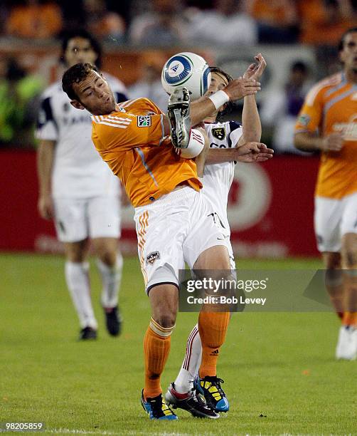 Brad Davis of the Houston Dynamo avoids the high boot to the face by Ned Grabavoy of Real Salt Lake April 1, 2010 in Houston, Texas.