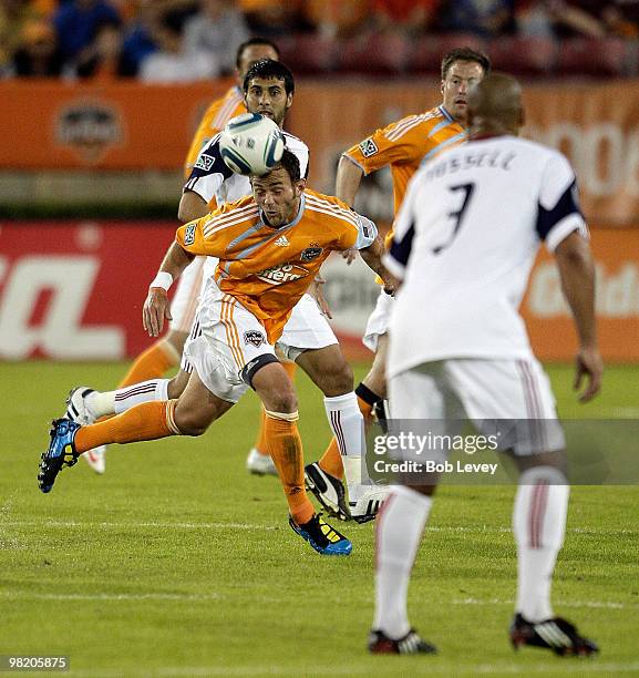 Brad Davis of the Houston Dynamo clears the ball away in midfield during the first half against Real Salt Lake on April 1, 2010 in Houston, Texas.