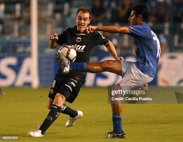 Emelec's Pedro Quinonez fights for the ball with Deportivo Quito's Ivan Borghelo during a 2010 Libertadores Cup match at the George Capwell Stadium...