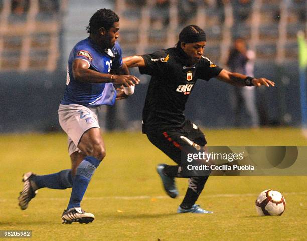 Gabriel Alchilier of Emelec fights for the ball with Miguel Arroyo of Deportivo Quito during a 2010 Libertadores Cup match at the George Capwell...