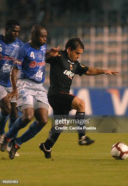 Luiz Zambrano of Emelec vies for the ball with Marcos Pirchio of Deportivo Quito during a 2010 Libertadores Cup match at the George Capwell Stadium...