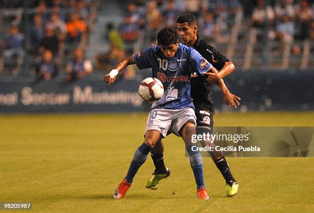 Joao Rojas of Emelec vies for the ball with Angel Escobar of Deportivo Quito during a 2010 Libertadores Cup match at the George Capwell Stadium on...