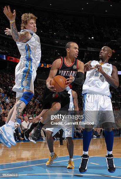 Jerryd Bayless of the Portland Trail Blazers goes to the basket against Chris Andersen and Johan Pertro of the Denver Nuggets on April 1, 2010 at the...