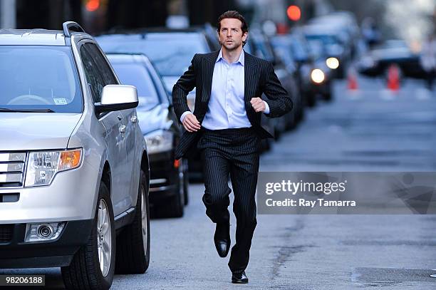 Actor Bradley Cooper films a scene at the "Dark Fields" movie set in the Upper East Side on April 01, 2010 in New York City.