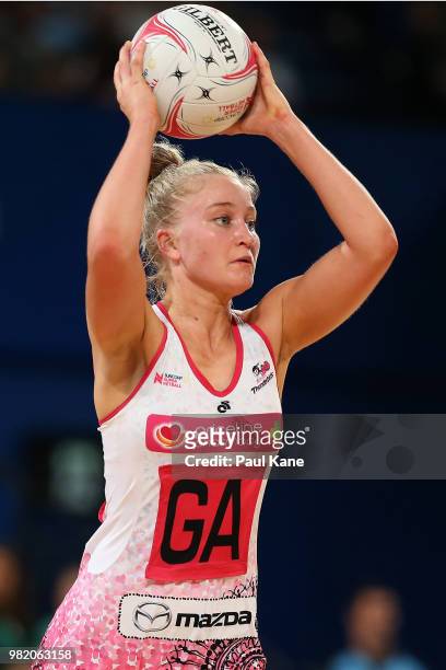 Charlee Hodges of the Thunderbirds looks to pass the ball during the round eight Super Netball match between the Fever and the Thunderbirds at Perth...