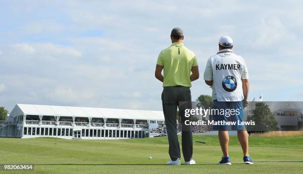 Martin Kaymer of Germany looks onwith his caddie on the 18th fairway during day three of the BMW International Open at Golf Club Gut Larchenhof on...