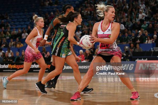 Chelsea Pitman of the Thunderbirds looks to pass the ball during the round eight Super Netball match between the Fever and the Thunderbirds at Perth...