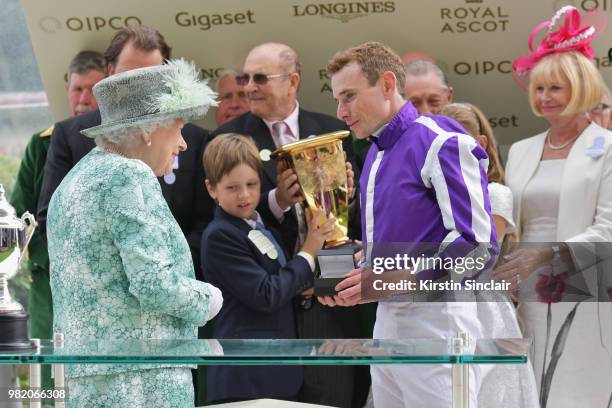 Queen Elizabeth II congratulates Ryan Moore who ride Merchant Navy to win The Diamond Jubilee Stakes on day 5 of Royal Ascot at Ascot Racecourse on...