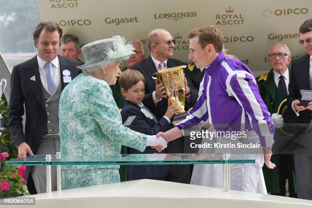 Queen Elizabeth II congratulates Ryan Moore who rode Merchant Navy to win The Diamond Jubilee Stakes on day 5 of Royal Ascot at Ascot Racecourse on...