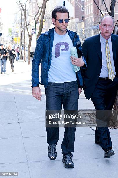 Actor Bradley Cooper walks to his trailer at the "Dark Fields" movie set in the Upper East Side on April 01, 2010 in New York City.