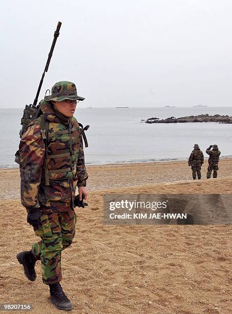 South Korean marines search for possible survivors and bodies from the sunken South Korean warship, patrol combat corvette PCC-772 Cheonan, at...