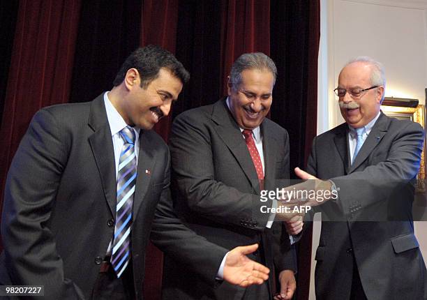 French oil giant Total chief executive Christophe de Margerie shakes hands with Qatari Prime Minister and Foreign Minister Sheikh Hamad bin Jassem...