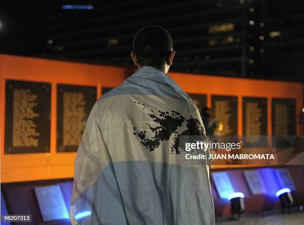 Young man wears an Argentine flag bearing the outline of the Islas Malvinas during the 28th Anniversary of the 1982 South Atlantic war between...