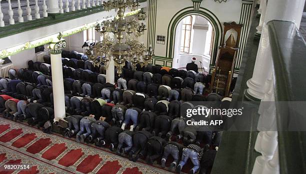 Muslim men pray inside a Moscow mosque on March 30, 2010. Russia's FSB security service has linked the recent metro bomb attacks to residents of...