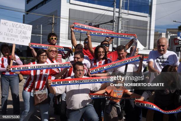 People demanding the Constitution be respected and protest against Paraguayan President Horacio Cartes --who's resignation the parliament is still to...