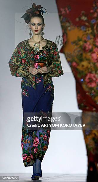Model displays a creation by Russian designer Slava Zaitsev during the Russian fashion week in Moscow on April 1, 2010. AFP PHOTO / ARTYOM KOROTAYEV