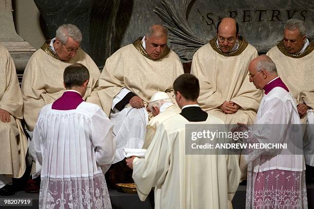 Pope Benedict XVI washes the feet of an unidentified layman during the evening mass of the Lord's Supper on April 01, 2010 in St Giovanni in Laterano...