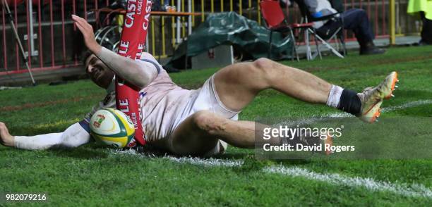 Jonny May of England crashes into the flag after scoring a try during the third test match between South Africa and England at Newlands Stadium on...