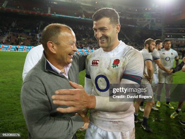 Eddie Jones, the England head coach celebrates wtih try scorer Jonny May after their victory during the third test match between South Africa and...