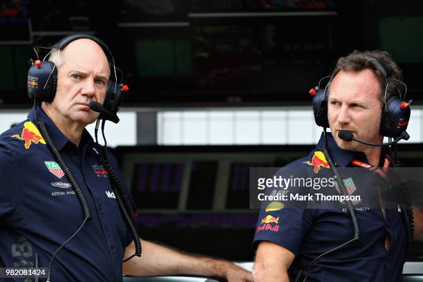 Red Bull Racing Team Principal Christian Horner and Adrian Newey, the Chief Technical Officer of Red Bull Racing look on from the pit wall during...