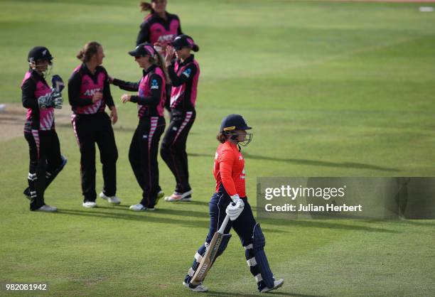 New Zealand players celebrate the wicket of the departing Tammy Beaumont of England during the International T20 Tri-Series match between England...