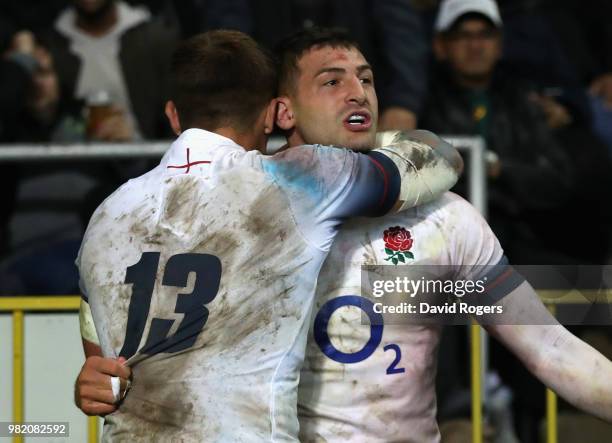 Jonny May of England celebrates with team mate Henry Slade after scoring a try during the third test match between South Africa and England at...